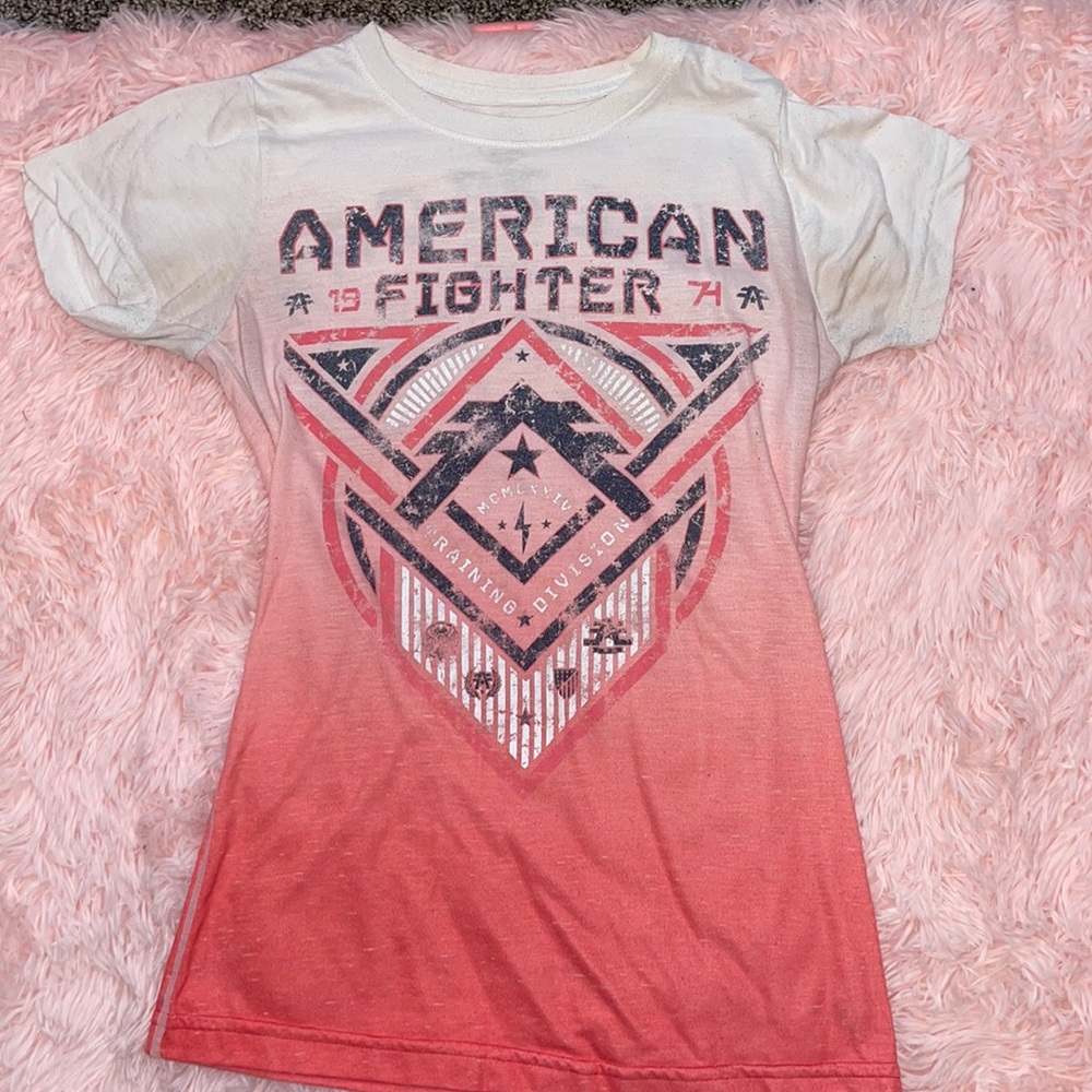 Shirt has been worn few times. Minor dark areas around armpit.